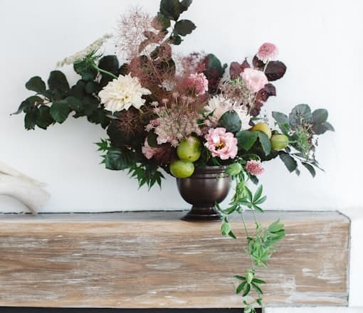 Red and white flowers on a wooden table